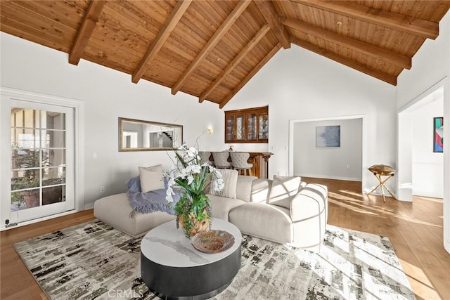 living room featuring high vaulted ceiling, wood ceiling, and beamed ceiling