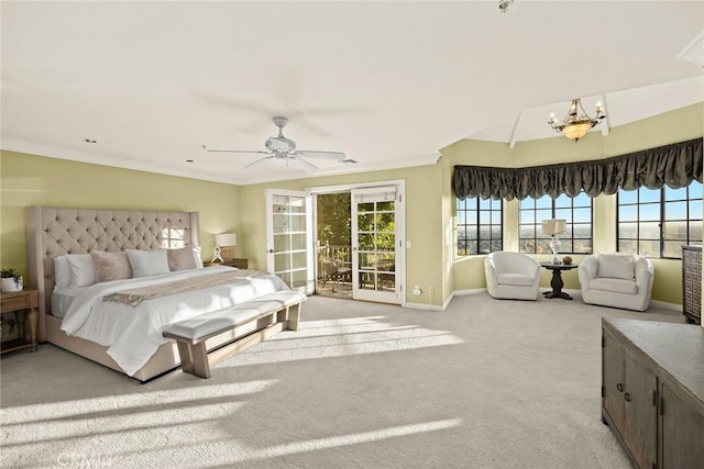 carpeted bedroom featuring ceiling fan with notable chandelier, access to exterior, and crown molding