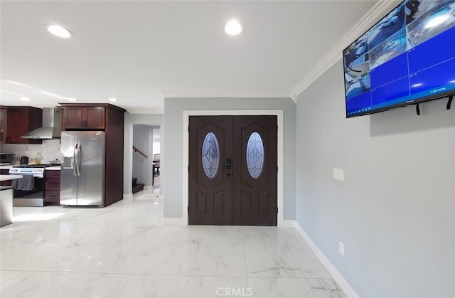 foyer featuring ornamental molding