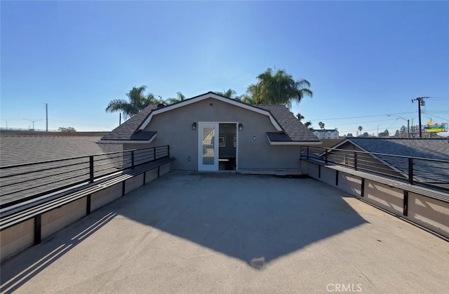 back of property featuring a patio