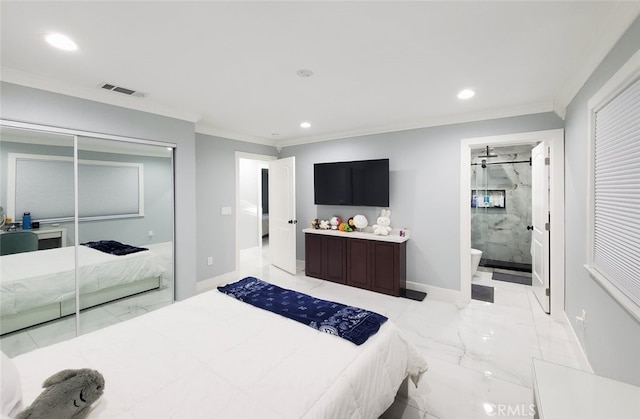 bedroom featuring ensuite bathroom, ornamental molding, and a closet