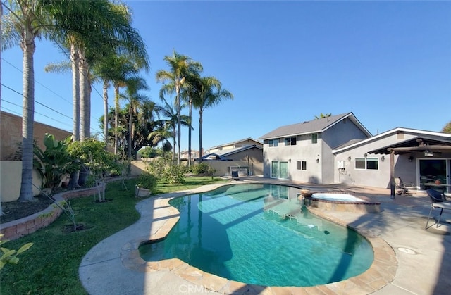 view of pool featuring an in ground hot tub and a patio