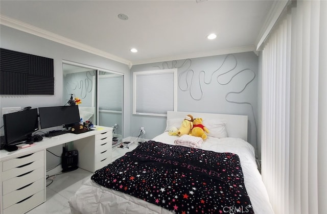 bedroom with crown molding and a closet