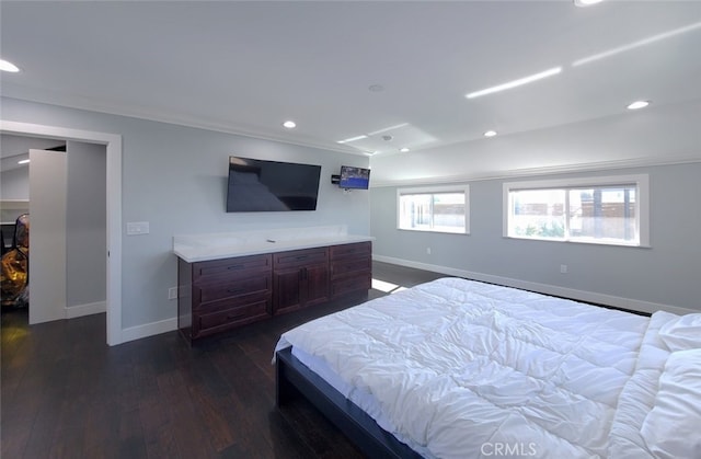 bedroom with crown molding and dark wood-type flooring