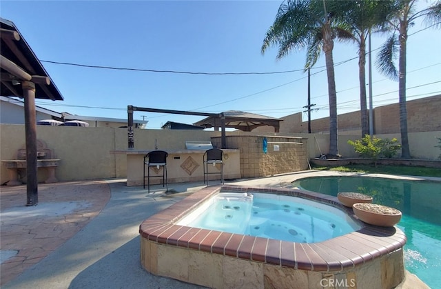 view of pool featuring a bar