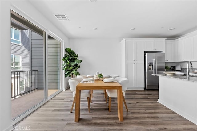 9431 N Sepulveda Blvd Unit 3, North Hills, CA 91343 - dining area with dark wood-style floors and recessed lighting