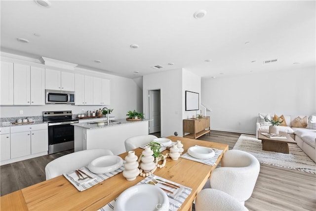 9431 N Sepulveda Blvd Unit 3, North Hills, CA 91343 - dining room with dark wood finished floors