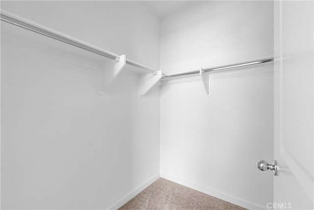 9431 N Sepulveda Blvd Unit 3, North Hills, CA 91343 - walk in closet featuring carpet flooring
