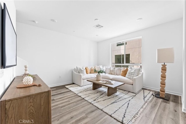 9431 N Sepulveda Blvd Unit 3, North Hills, CA 91343 - living room featuring light wood-style floors and baseboards