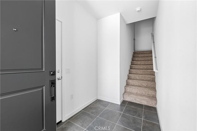 9431 N Sepulveda Blvd Unit 3, North Hills, CA 91343 - staircase featuring tile patterned floors and baseboards