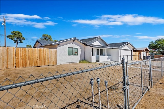 ranch-style home with a garage