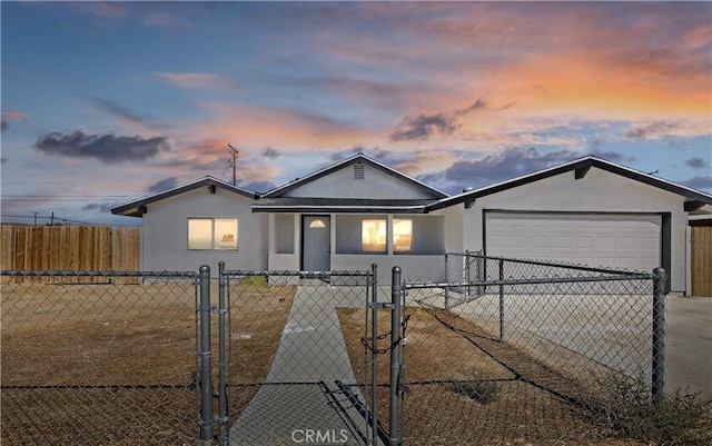 ranch-style house featuring a garage