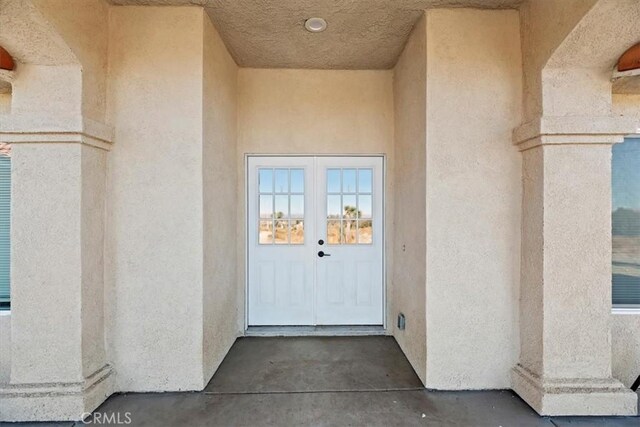 property entrance with french doors