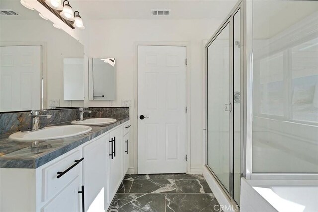 bathroom featuring vanity and walk in shower