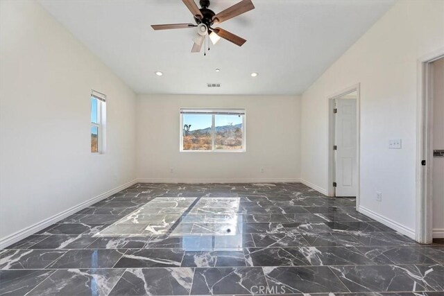 unfurnished room featuring ceiling fan