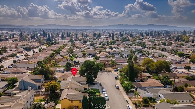 drone / aerial view featuring a mountain view