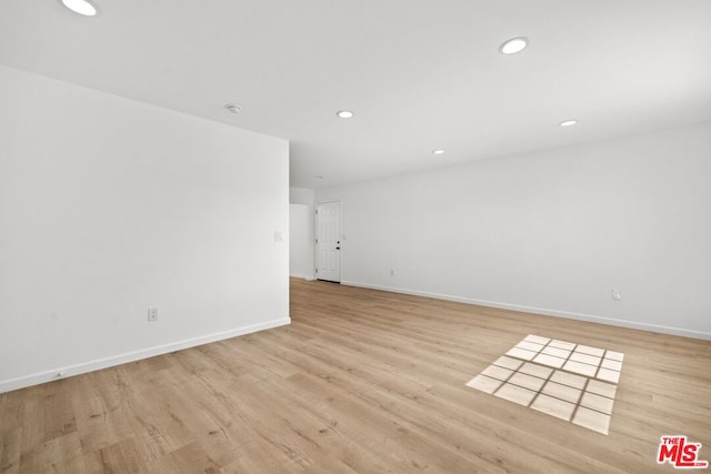 spare room featuring light hardwood / wood-style flooring