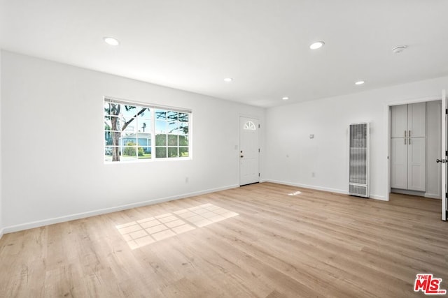 spare room featuring light hardwood / wood-style flooring