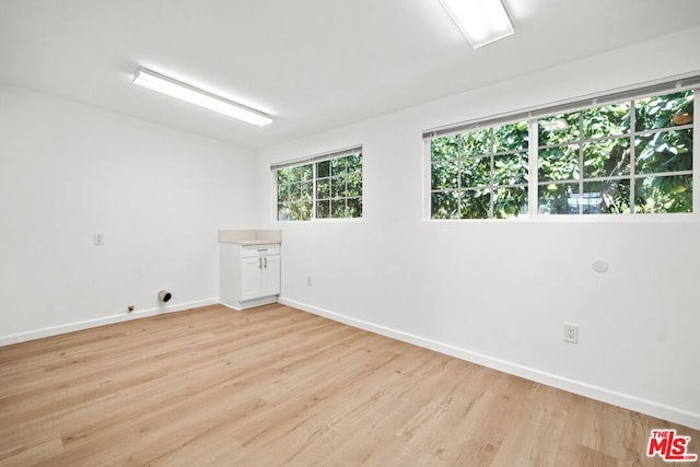 spare room with light wood-type flooring