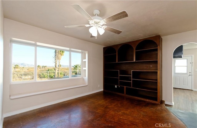 unfurnished room featuring ceiling fan