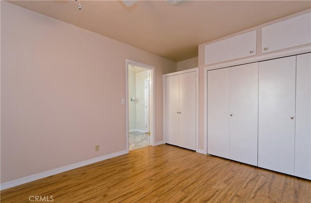 unfurnished bedroom featuring light wood-type flooring