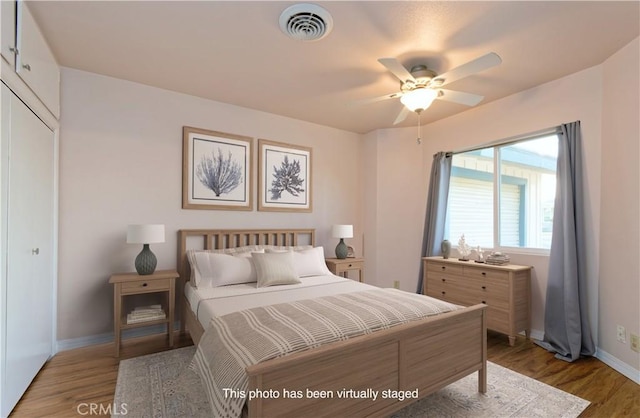 bedroom featuring ceiling fan and light hardwood / wood-style flooring