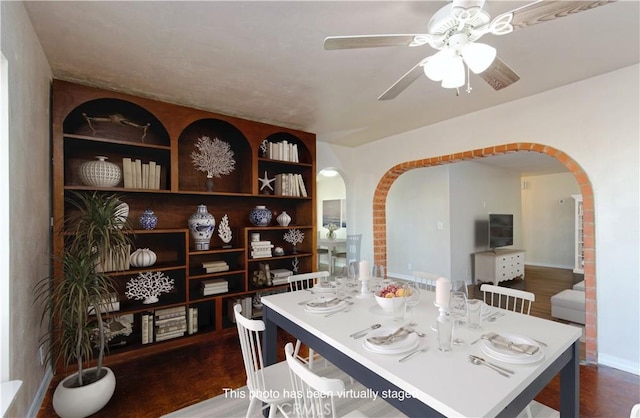 dining room featuring dark hardwood / wood-style floors and ceiling fan