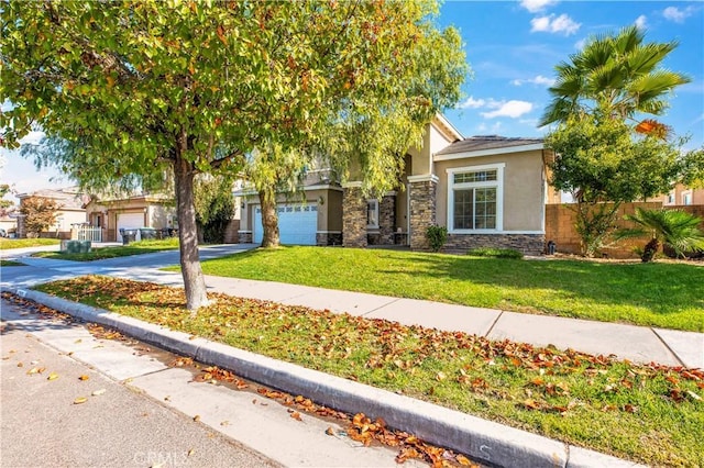 view of property hidden behind natural elements featuring a front lawn