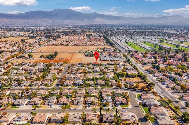 birds eye view of property featuring a mountain view