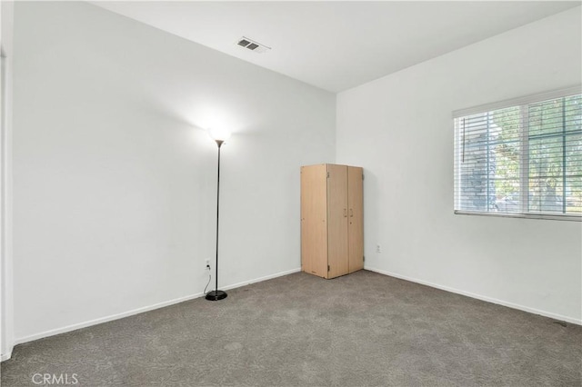 spare room featuring carpet flooring