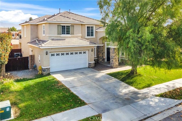 view of front property featuring a garage and a front lawn