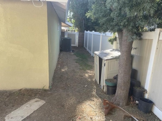 view of yard featuring central air condition unit