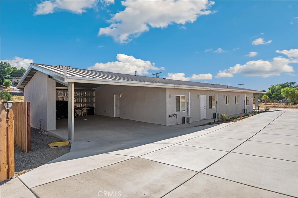 view of front of home with a carport