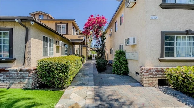 property entrance with a wall mounted air conditioner