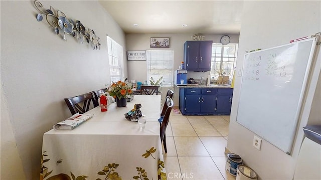 dining area featuring a wealth of natural light and light tile patterned flooring