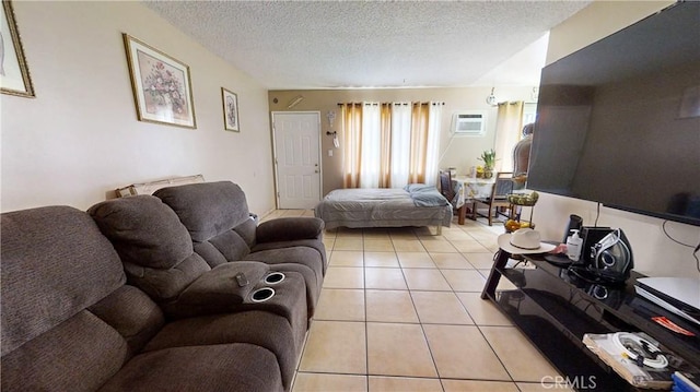 tiled living room featuring a textured ceiling and a wall unit AC