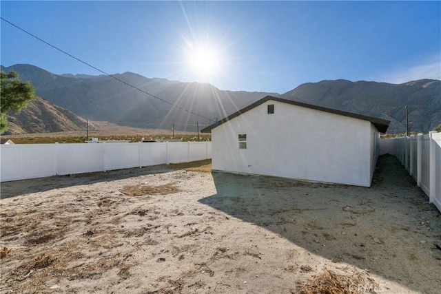 view of home's exterior featuring a mountain view