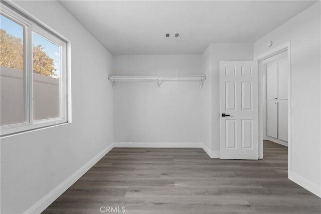 spacious closet featuring hardwood / wood-style flooring