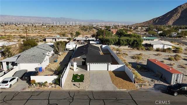 drone / aerial view featuring a mountain view