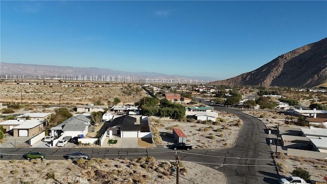 birds eye view of property featuring a mountain view