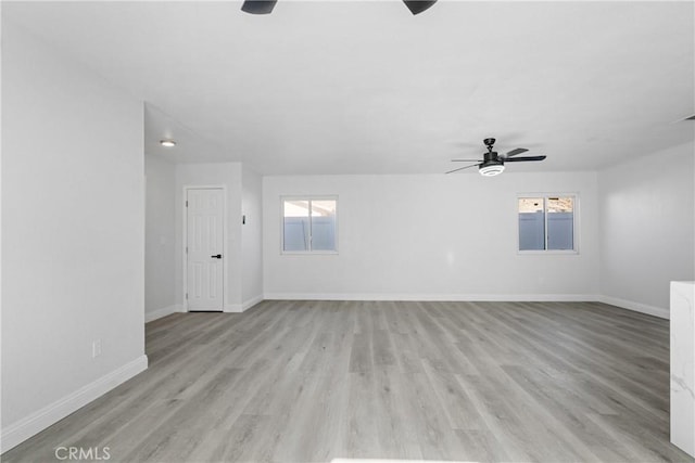 empty room featuring light hardwood / wood-style flooring and ceiling fan