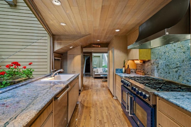 kitchen featuring sink, wall chimney exhaust hood, wooden ceiling, light hardwood / wood-style floors, and appliances with stainless steel finishes