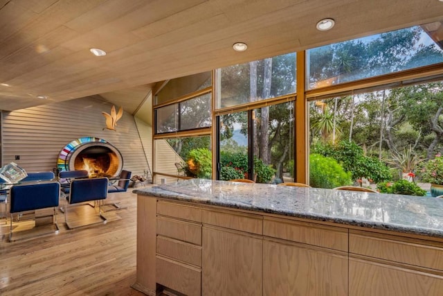 sunroom / solarium with wood ceiling and a wealth of natural light