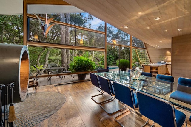 sunroom with wooden ceiling and lofted ceiling