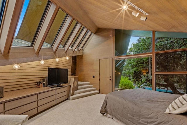 bedroom featuring track lighting, wood ceiling, vaulted ceiling, wooden walls, and carpet floors