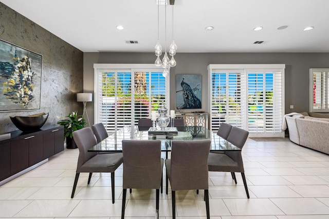 tiled dining room featuring a wealth of natural light