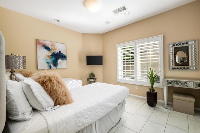 bedroom featuring light tile patterned floors