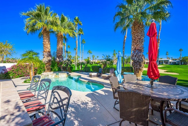 view of swimming pool with a lawn, a patio, and an in ground hot tub