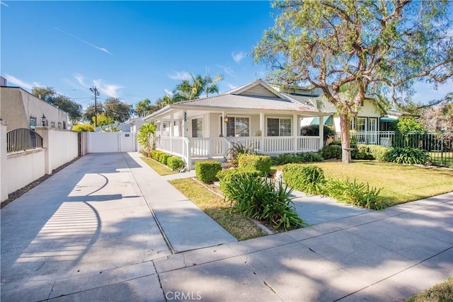 view of front of house featuring a front yard and a porch