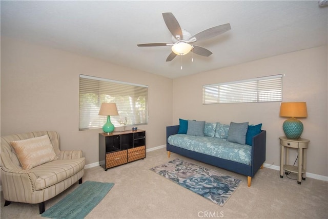 living room with carpet flooring and ceiling fan